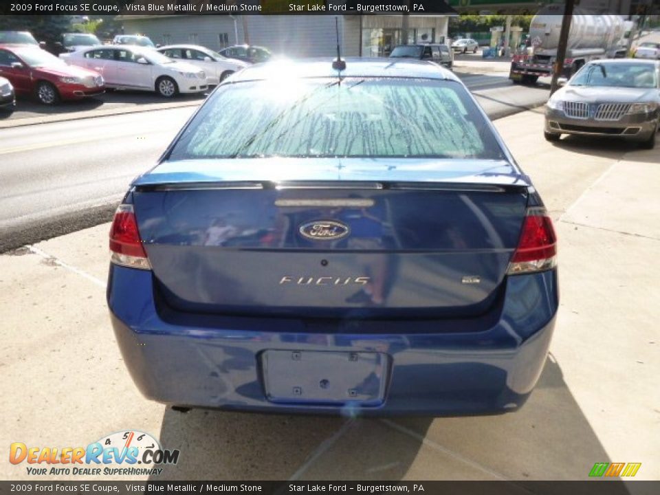 2009 Ford Focus SE Coupe Vista Blue Metallic / Medium Stone Photo #6