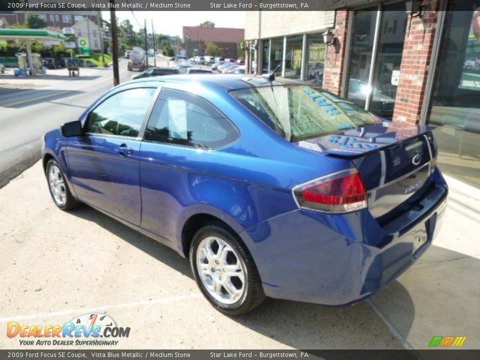 2009 Ford Focus SE Coupe Vista Blue Metallic / Medium Stone Photo #7