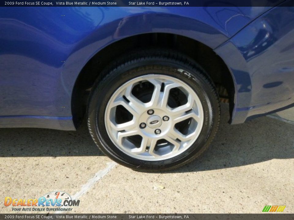 2009 Ford Focus SE Coupe Vista Blue Metallic / Medium Stone Photo #9