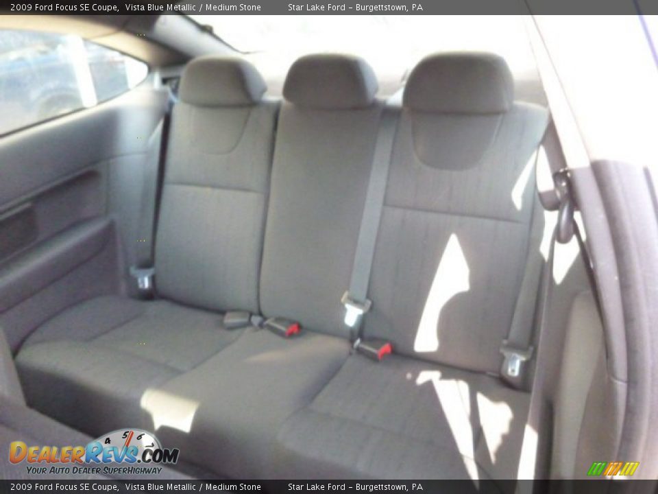 2009 Ford Focus SE Coupe Vista Blue Metallic / Medium Stone Photo #12