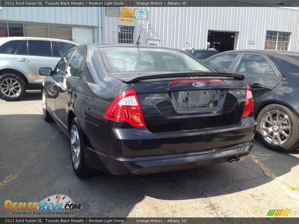 2011 Ford Fusion SE Tuxedo Black Metallic / Medium Light Stone Photo #4