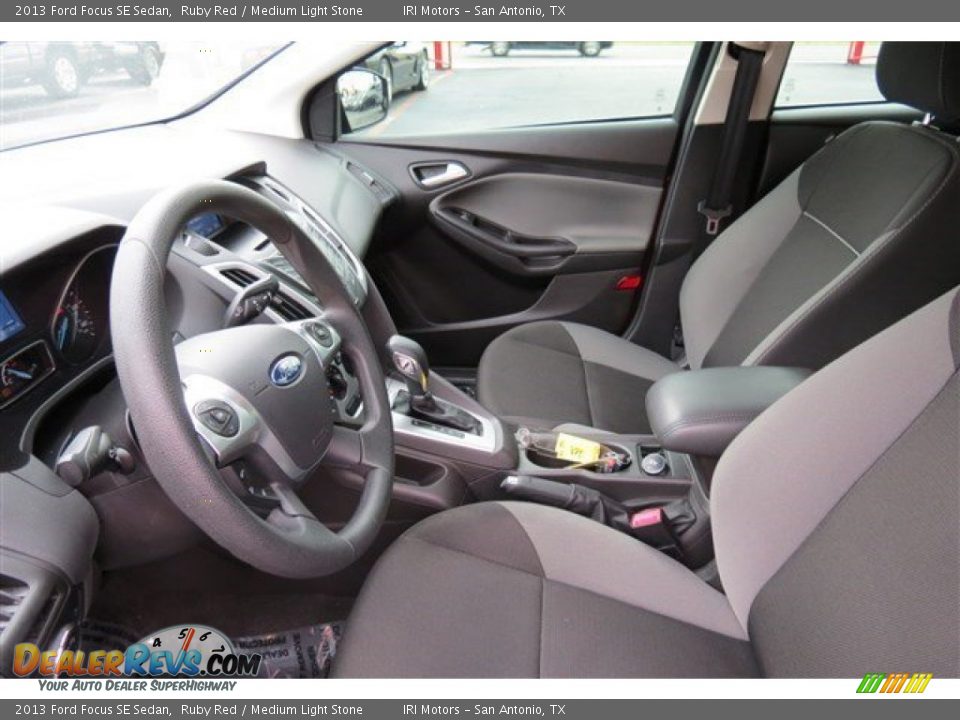 2013 Ford Focus SE Sedan Ruby Red / Medium Light Stone Photo #11