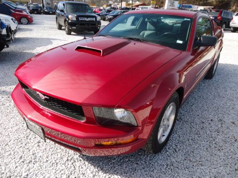 Redfire Metallic Ford Mustang V6 Deluxe Coupe.  Click to enlarge.