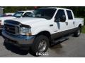 Front 3/4 View of 2004 Ford F250 Super Duty Lariat Crew Cab 4x4 #1