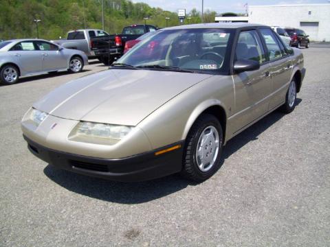 Gold Saturn S Series SL1 Sedan.  Click to enlarge.