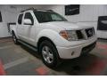 Front 3/4 View of 2006 Nissan Frontier LE Crew Cab 4x4 #5