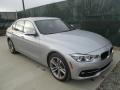 Front 3/4 View of 2017 BMW 3 Series 330i xDrive Sedan #5