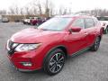 Front 3/4 View of 2017 Nissan Rogue SL AWD #11