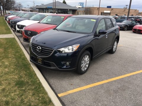 Deep Crystal Blue Mica Mazda CX-5 Touring AWD. Click to enlarge. Deep Crystal Blue Mica Mazda CX-5 Touring AWD. Click to enlarge.