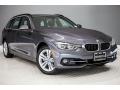 Front 3/4 View of 2018 BMW 3 Series 330i xDrive Sports Wagon #12