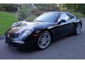 Front 3/4 View of 2016 Porsche 911 Carrera Coupe Black Edition #1