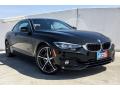 Front 3/4 View of 2019 BMW 4 Series 430i Coupe #12