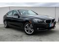Front 3/4 View of 2019 BMW 3 Series 330i xDrive Gran Turismo #12