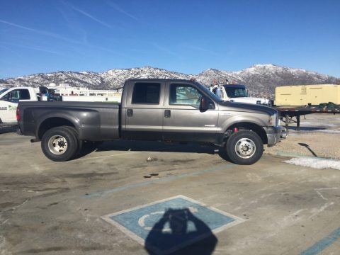 Silver Metallic Ford F350 Super Duty Lariat Crew Cab 4x4 Dually.  Click to enlarge.