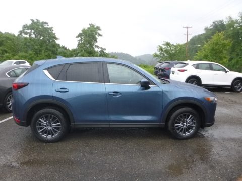 Eternal Blue Mica Mazda CX-5 Touring AWD. Click to enlarge. Eternal Blue Mica Mazda CX-5 Touring AWD. Click to enlarge.