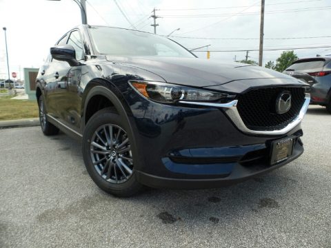 Deep Crystal Blue Mica Mazda CX-5 Touring AWD. Click to enlarge. Deep Crystal Blue Mica Mazda CX-5 Touring AWD. Click to enlarge.