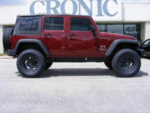 Red Rock Crystal Pearl Coat 2009 Jeep Wrangler Unlimited X 4x4 with Dark 