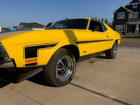 Grabber Yellow Ford Mustang Mach 1.  Click to enlarge.