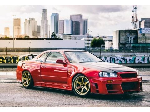 Active Red Nissan Skyline GT-R R34 Coupe.  Click to enlarge.