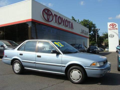 Ice Blue Pearl Metallic Toyota Corolla DX Sedan.  Click to enlarge.