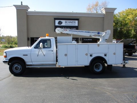 White Ford F Super Duty Regular Cab Chassis Auto Crane.  Click to enlarge.