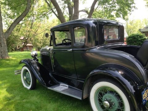 Black Ford Model A Deluxe 5 Window Coupe.  Click to enlarge.