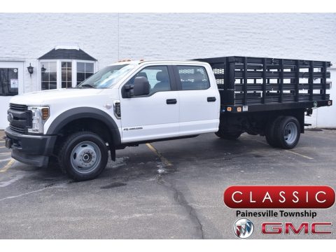 White Ford F550 Super Duty XL Crew Cab 4x4 Stake Truck.  Click to enlarge.