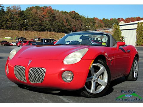 Aggressive Red Pontiac Solstice Roadster.  Click to enlarge.