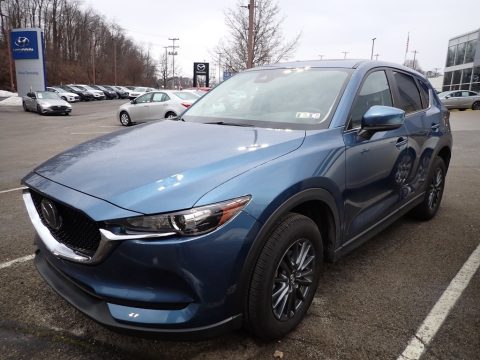 Eternal Blue Mica Mazda CX-5 Touring AWD.  Click to enlarge. Eternal Blue Mica Mazda CX-5 Touring AWD.  Click to enlarge.