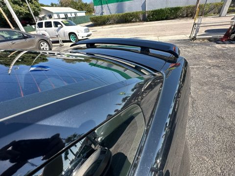 Black Ford Mustang V6 Deluxe Coupe.  Click to enlarge.