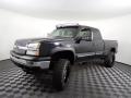 Front 3/4 View of 2005 Chevrolet Silverado 1500 Z71 Extended Cab 4x4 #3