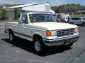 Front 3/4 View of 1988 Ford F150 XLT Lariat Regular Cab 4x4 #7