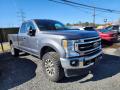 Front 3/4 View of 2021 Ford F250 Super Duty Lariat Crew Cab 4x4 #3