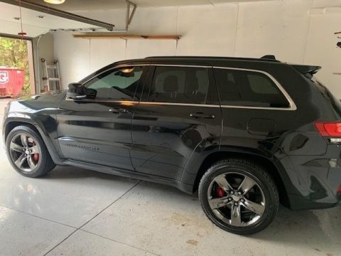 Brilliant Black Crystal Pearl Jeep Grand Cherokee SRT 4x4 Red Vapor Edition.  Click to enlarge.