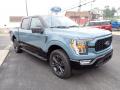 Front 3/4 View of 2023 Ford F150 XLT SuperCrew 4x4 Heritage Edition #7