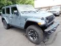 Front 3/4 View of 2024 Jeep Wrangler 4-Door Rubicon X 4xe Hybrid #9