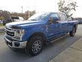 Front 3/4 View of 2021 Ford F350 Super Duty Lariat Crew Cab 4x4 #7