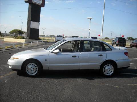 Bright Silver Saturn L Series L100 Sedan.  Click to enlarge.