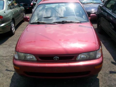 Sunfire Red Pearl Metallic Toyota Corolla DX.  Click to enlarge.