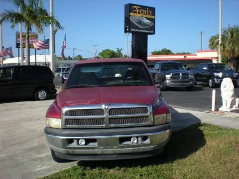 Metallic Red Dodge Ram 1500 SLT Extended Cab.  Click to enlarge.