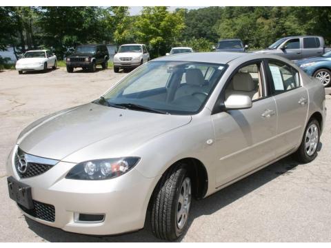 Shimmering Sand Metallic Mazda MAZDA3 i Sedan.  Click to enlarge.