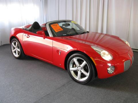 Aggressive Red Pontiac Solstice Roadster.  Click to enlarge.