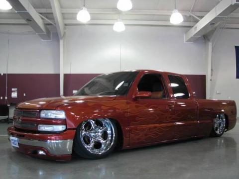 Sunset Orange Metallic Chevrolet Silverado 1500 LS Extended Cab 4x4.  Click to enlarge.