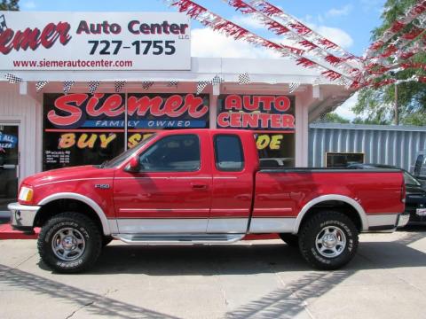 Bright Red Ford F150 Lariat Extended Cab 4x4.  Click to enlarge.