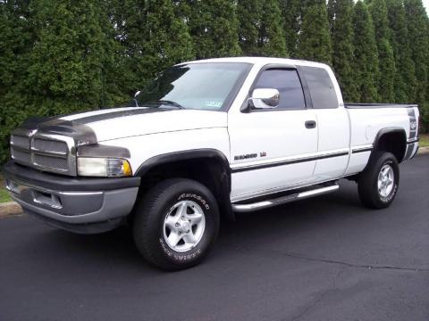 Bright White Dodge Ram 1500 Laramie SLT Extended Cab 4x4.  Click to enlarge.