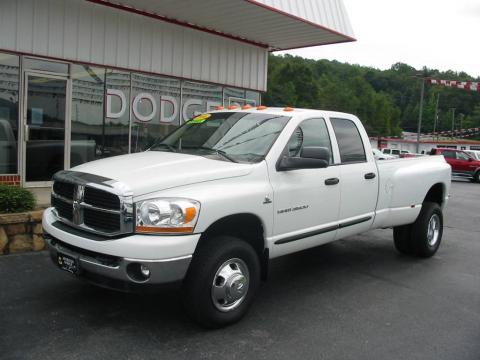 Bright White Dodge Ram 3500 SLT Quad Cab 4x4 Dually.  Click to enlarge.