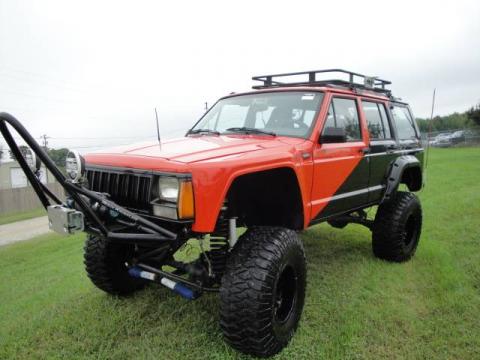 Orange/Black Jeep Cherokee Sport 4x4.  Click to enlarge.