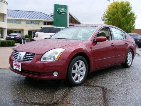 Red Opulence Nissan Maxima 3.5 SL.  Click to enlarge.
