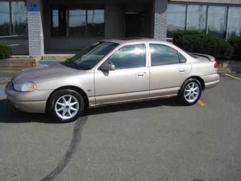 Light Prairie Tan Metallic Ford Contour SE.  Click to enlarge.