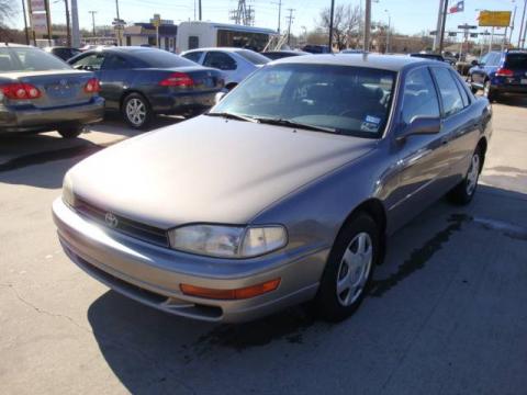 Almond Beige Pearl Toyota Camry LE V6 Sedan.  Click to enlarge.